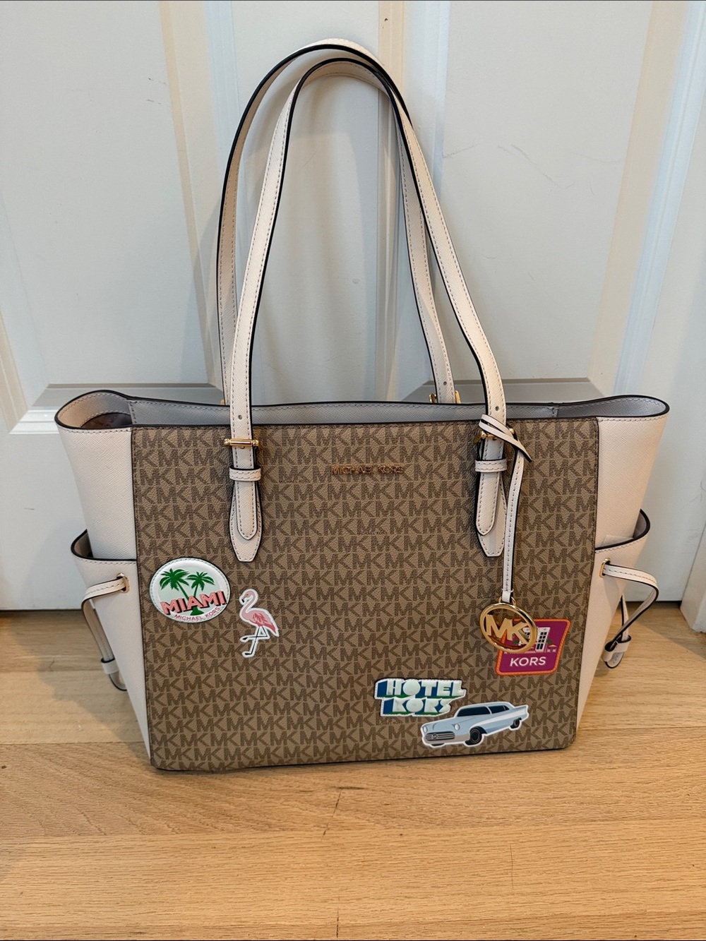 Michael Kors Brown Signature MK Tote with Light Pink Trim and Travel Patches